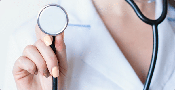 Close-up of physician holding stethoscope up
